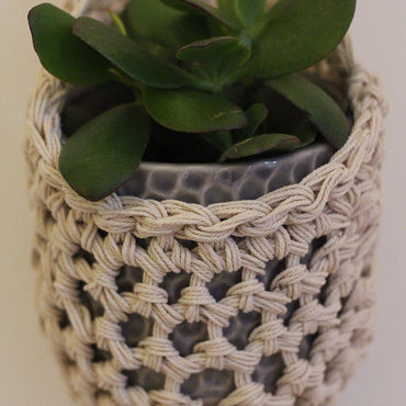 Image showing close rochet details of tierdrop shape cotton plant hanger, containing pot and plant. To give an idea of how the planter would look in situ.