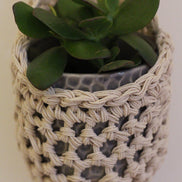 Image showing close rochet details of tierdrop shape cotton plant hanger, containing pot and plant. To give an idea of how the planter would look in situ.